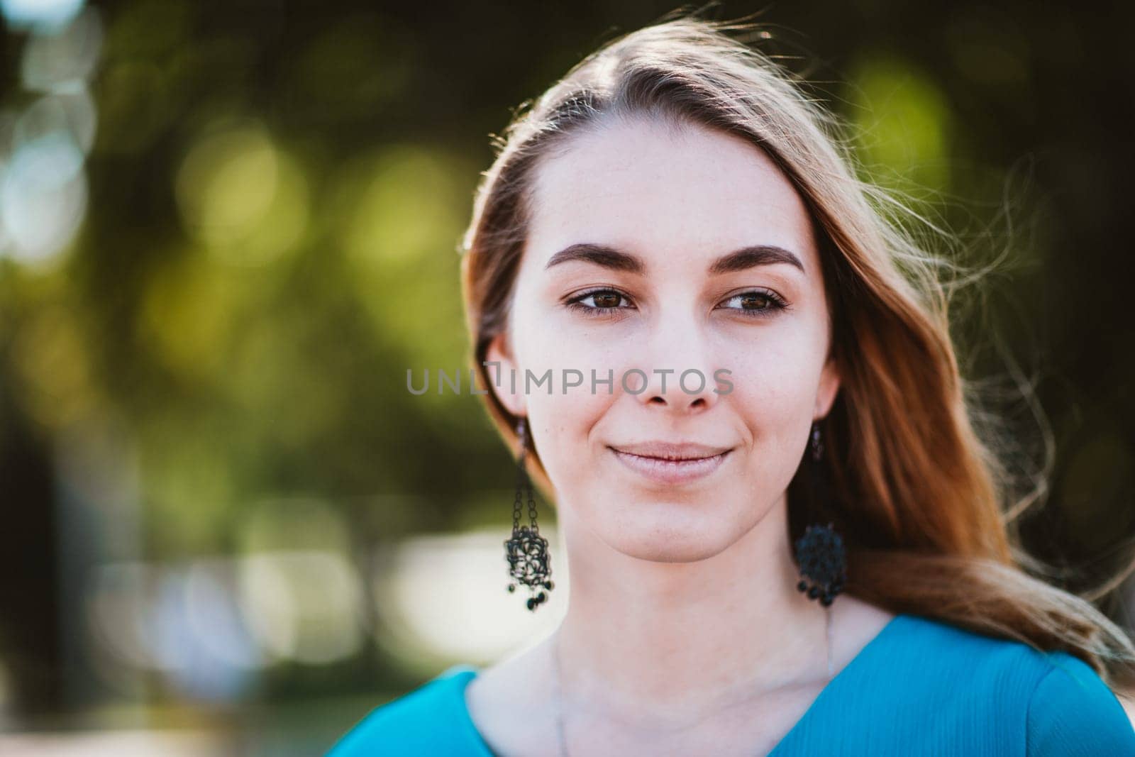 Portrait of a young woman on a blurred background.