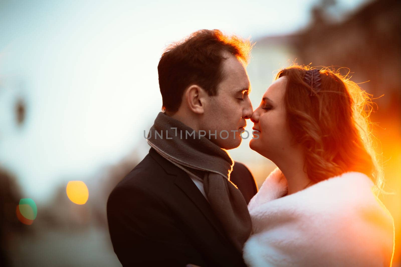 young couple on the background of the street in lanterns.