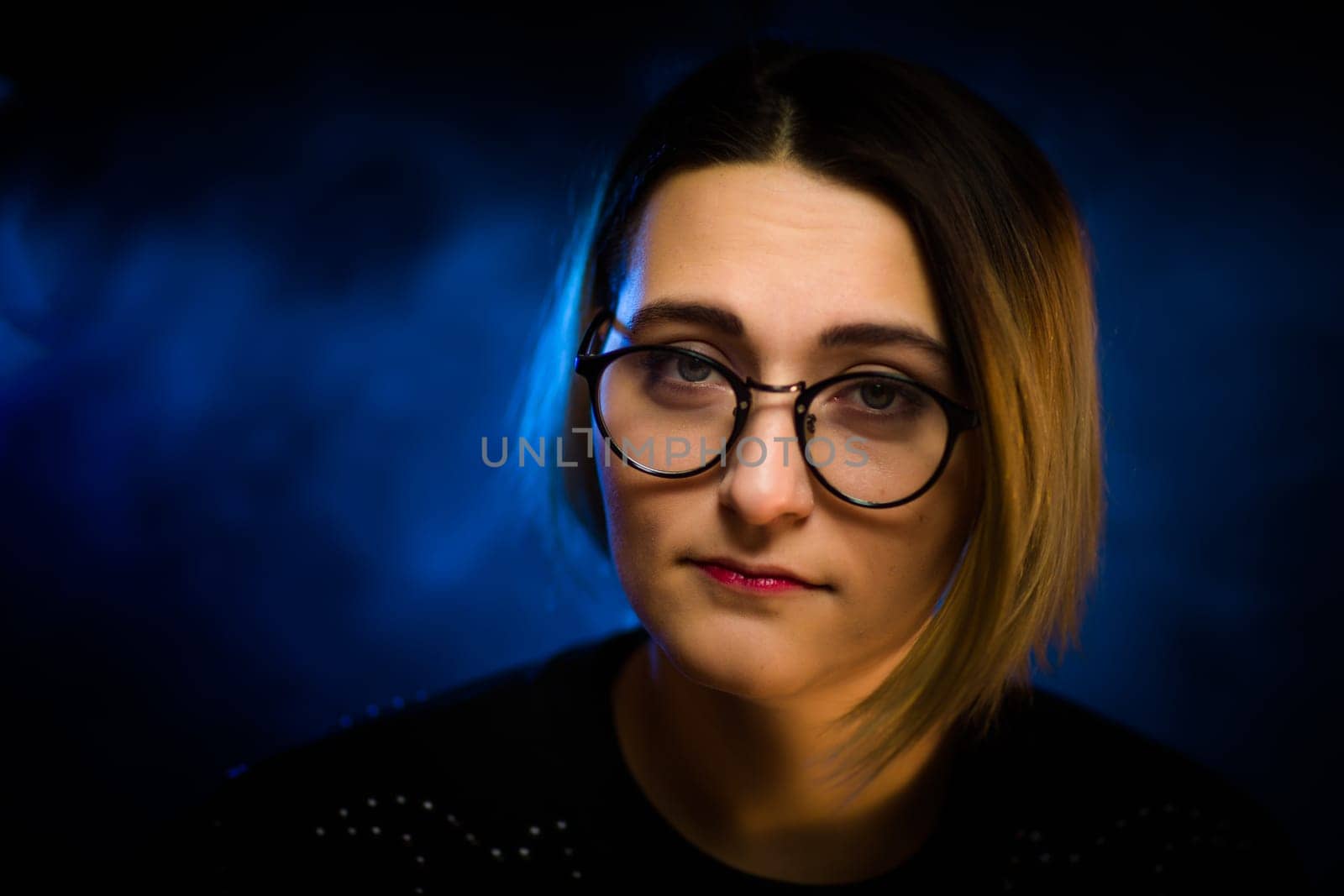 portrait emotional young girl on blue background.