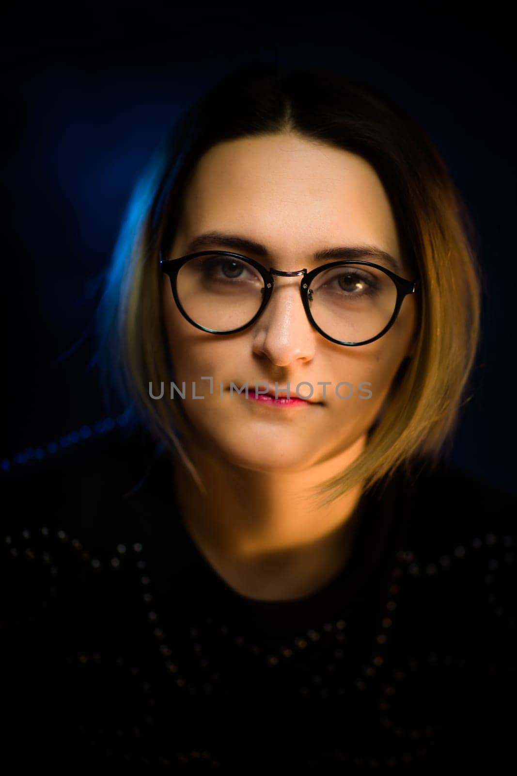 portrait emotional young girl on blue background.