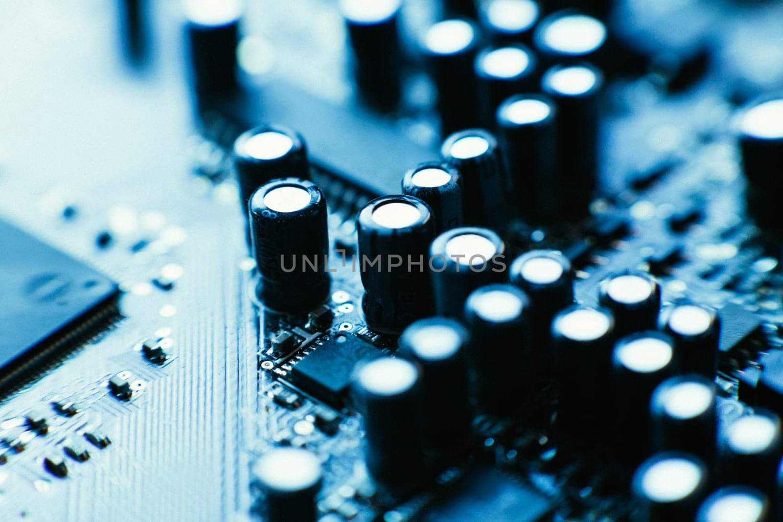 computer board capacitors blue color close up.