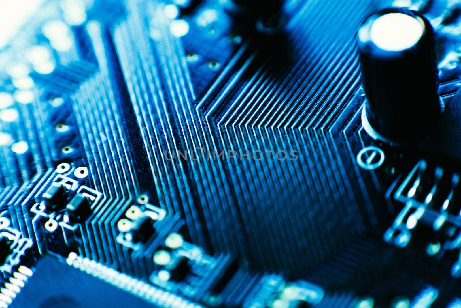 computer board capacitors blue color close up.