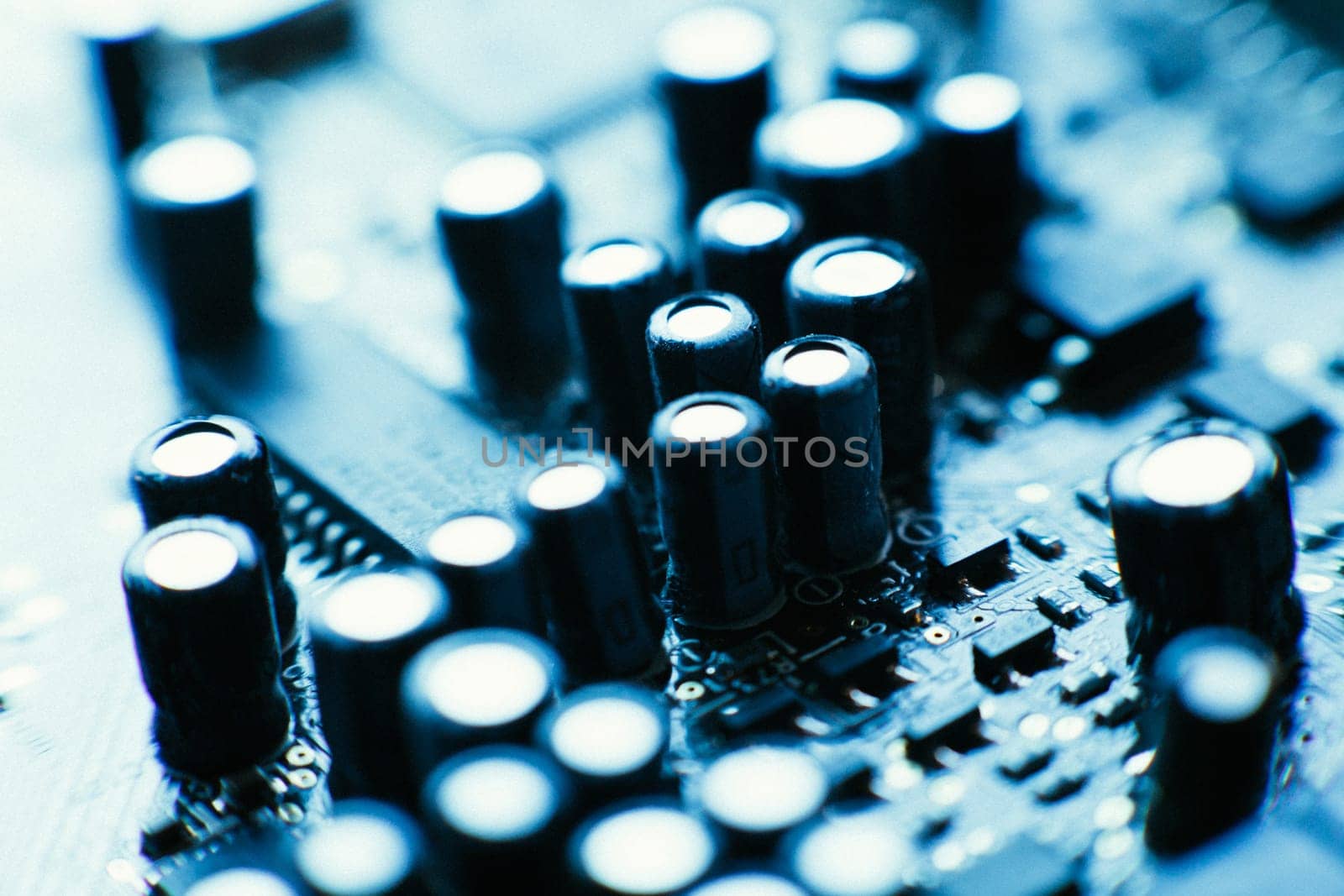 computer board capacitors blue color close up.