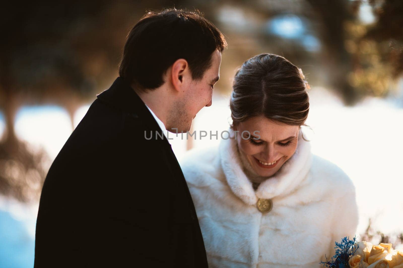 Lovers bride and groom on their winter wedding.