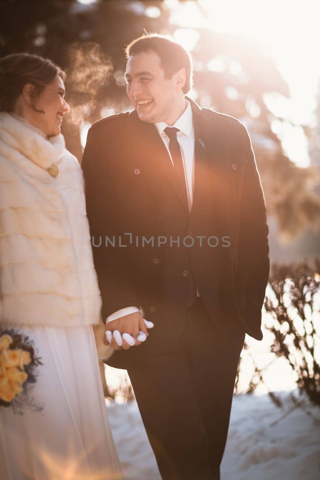 Lovers bride and groom on their winter wedding.