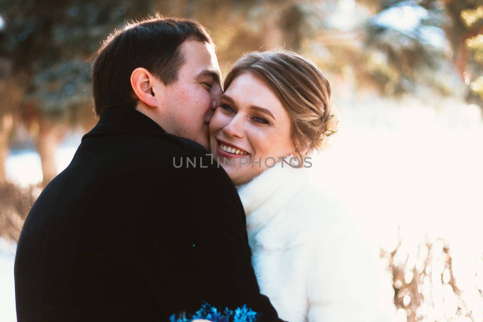 Lovers bride and groom on their winter wedding.