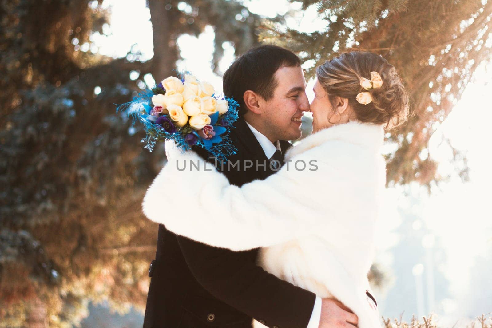 Winter bright wedding bride and groom couple.