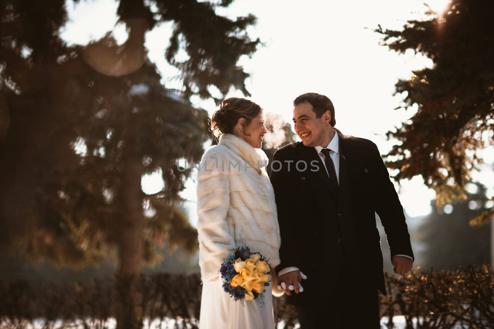 Lovers bride and groom on their winter wedding.