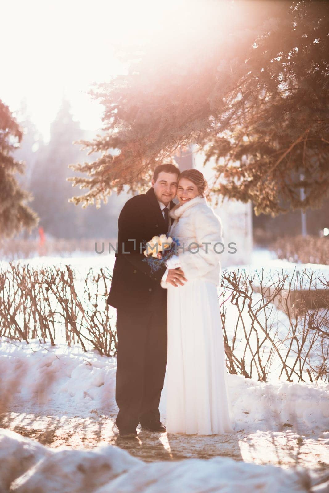Winter bright wedding bride and groom couple.
