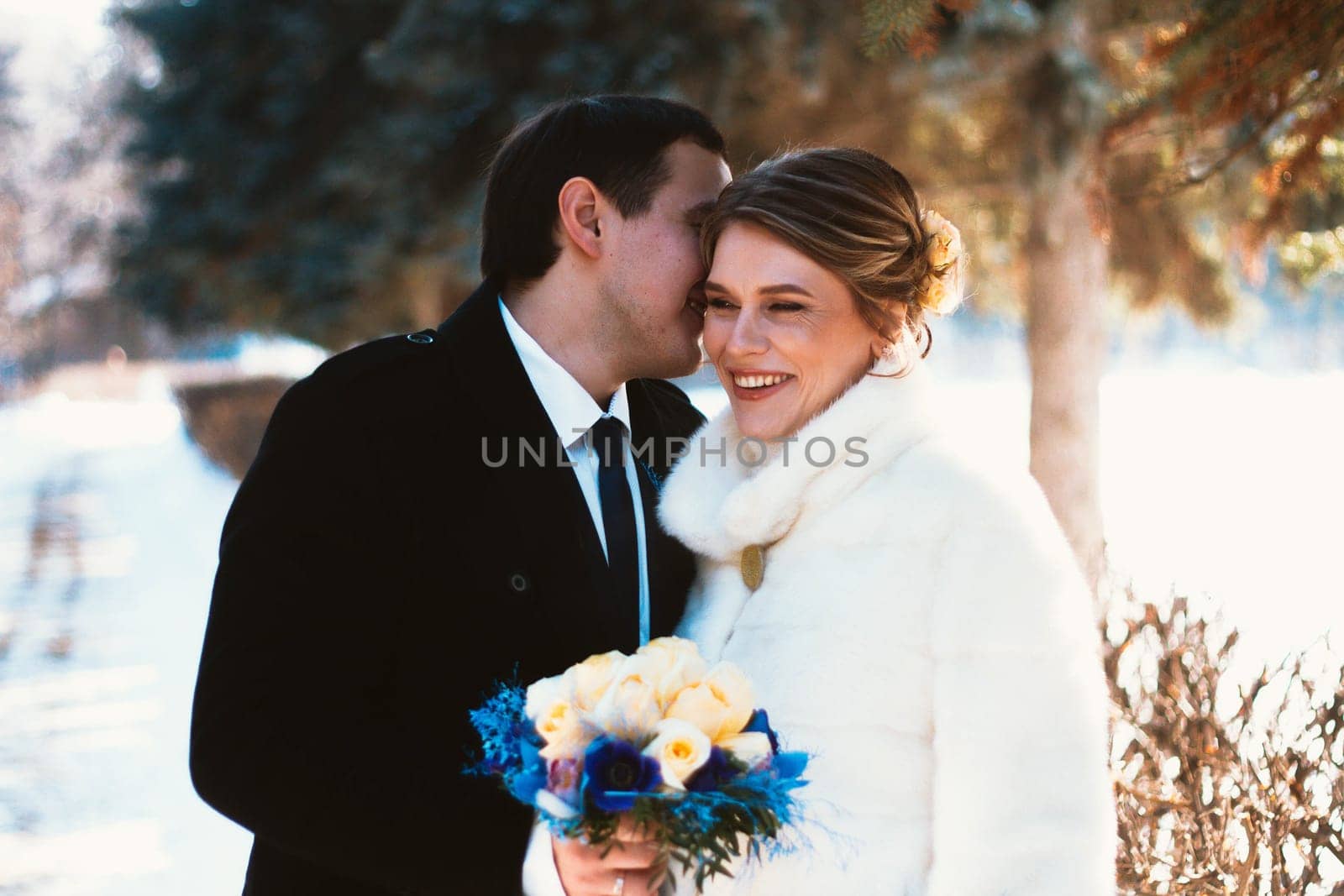 Winter bright wedding bride and groom couple.