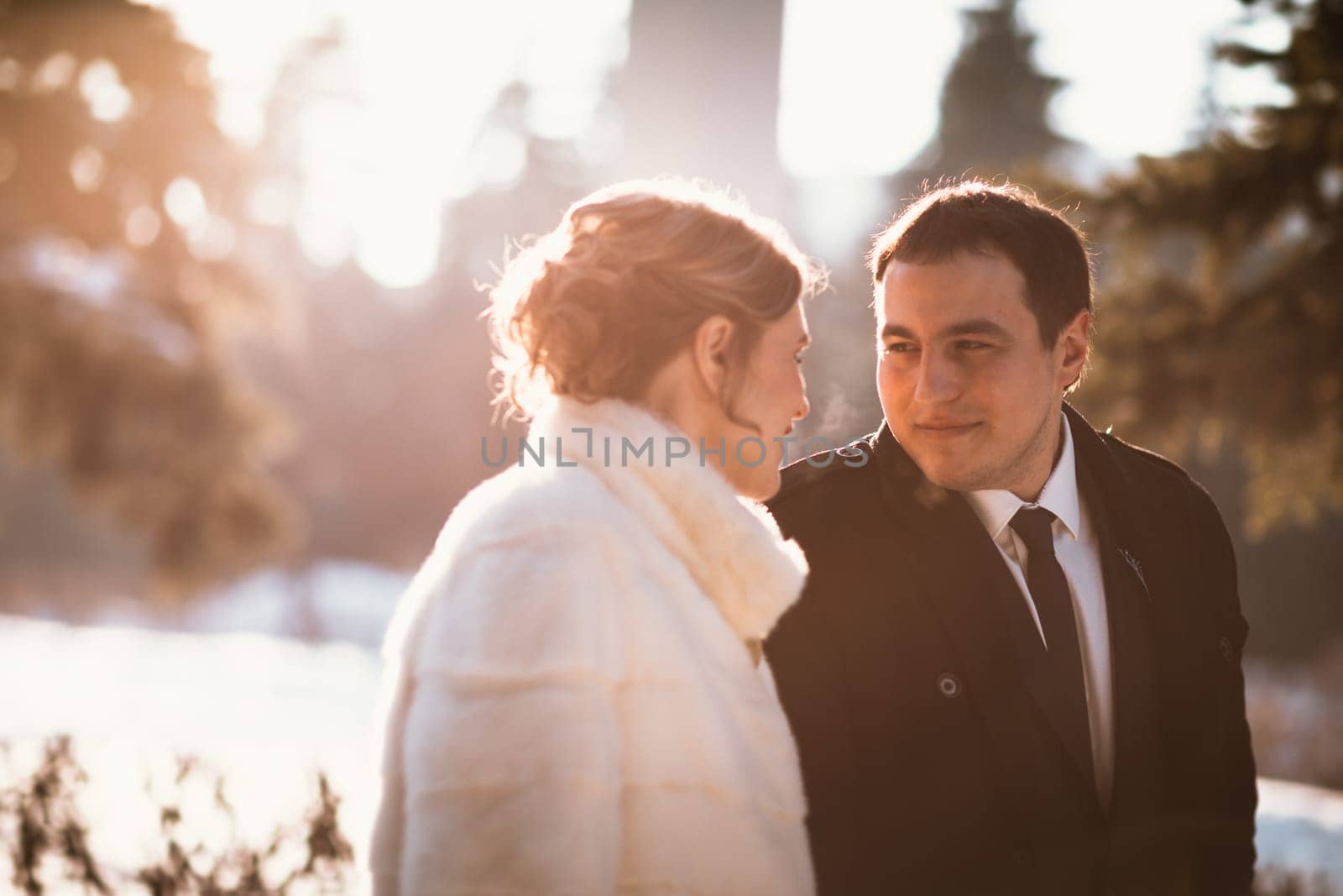 Lovers bride and groom on their winter wedding.