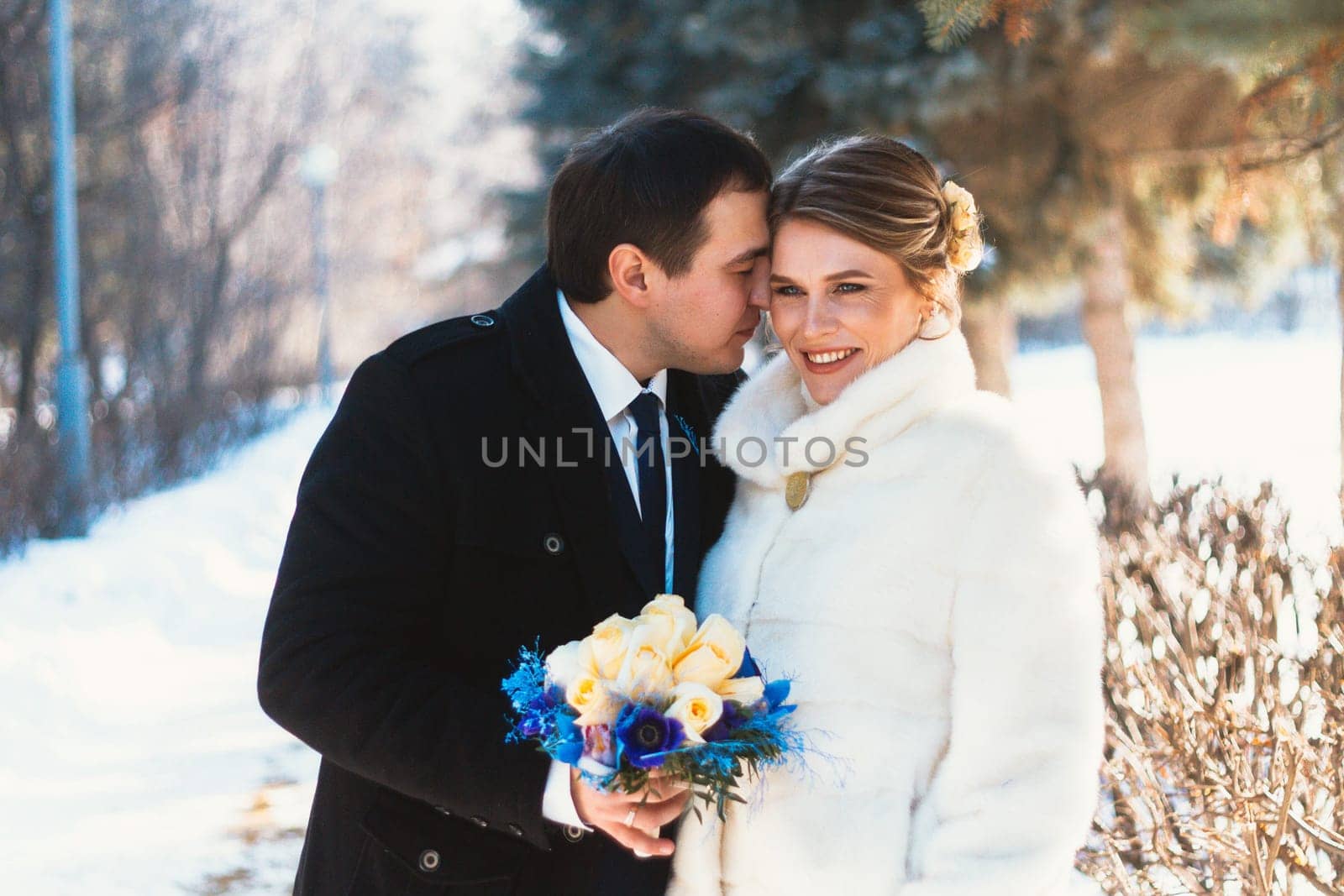Winter bright wedding bride and groom couple.