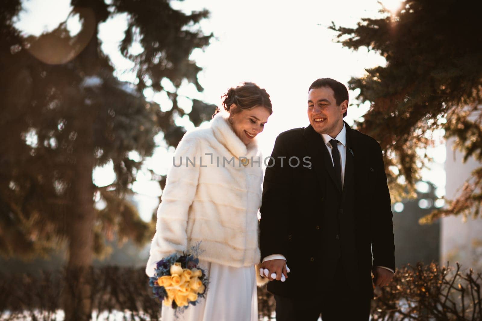 Lovers bride and groom on their winter wedding.