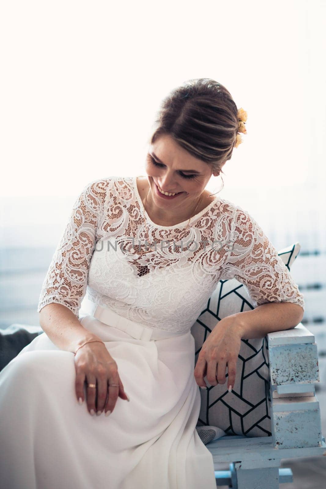 portrait of a bride near a window studio.
