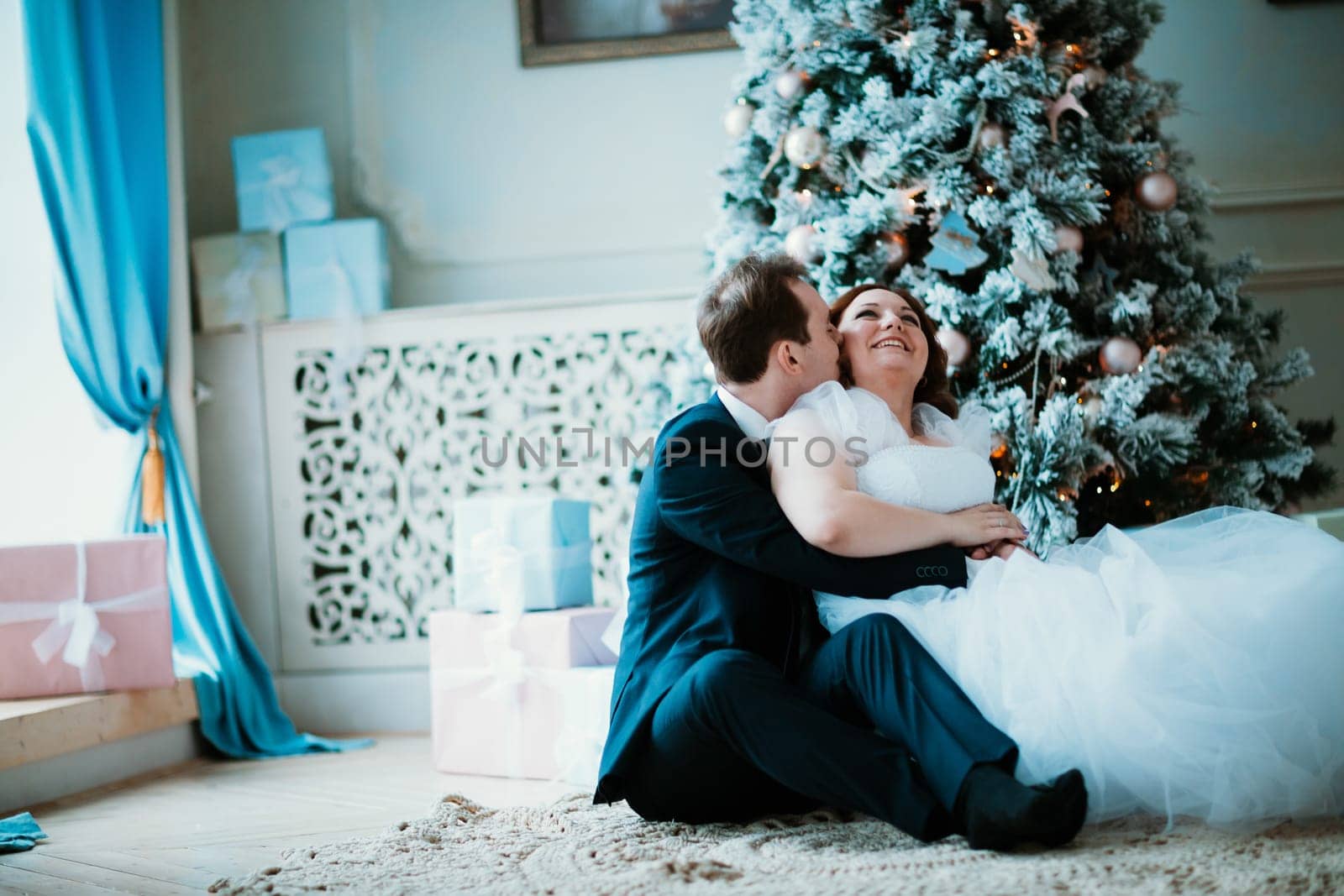 young bride and groom couple in a bright studio photo.
