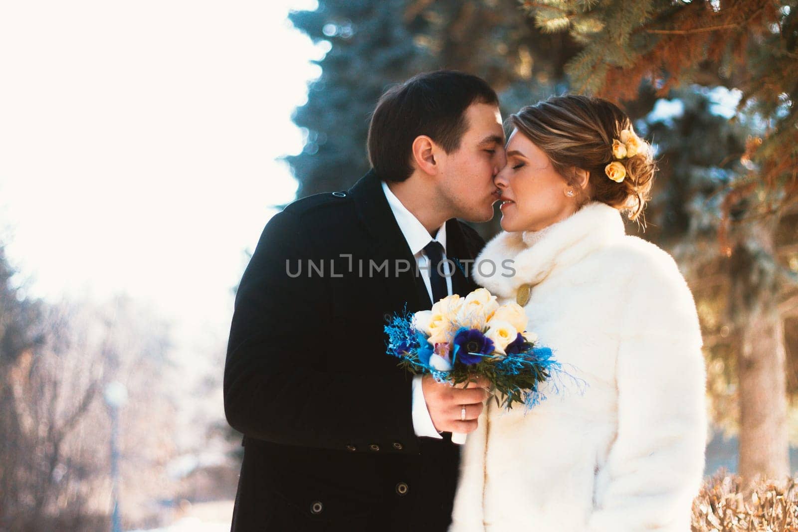 Winter bright wedding bride and groom couple.
