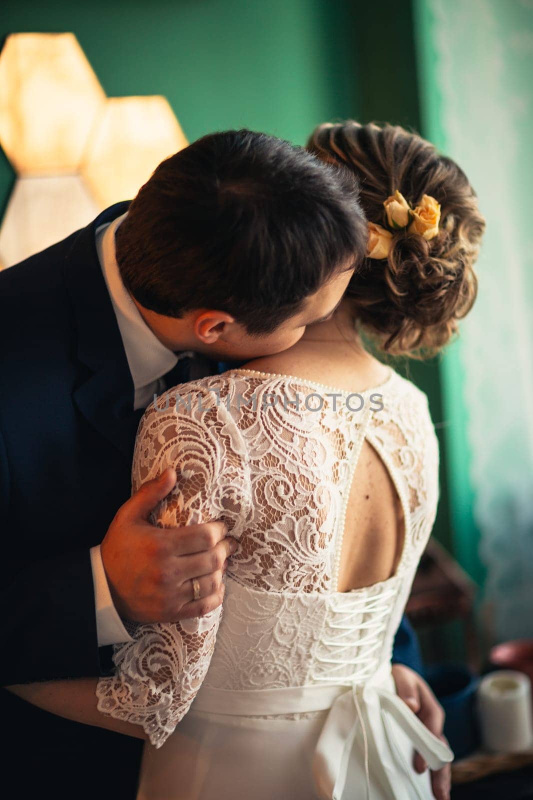 couple groom and bride in light studio.