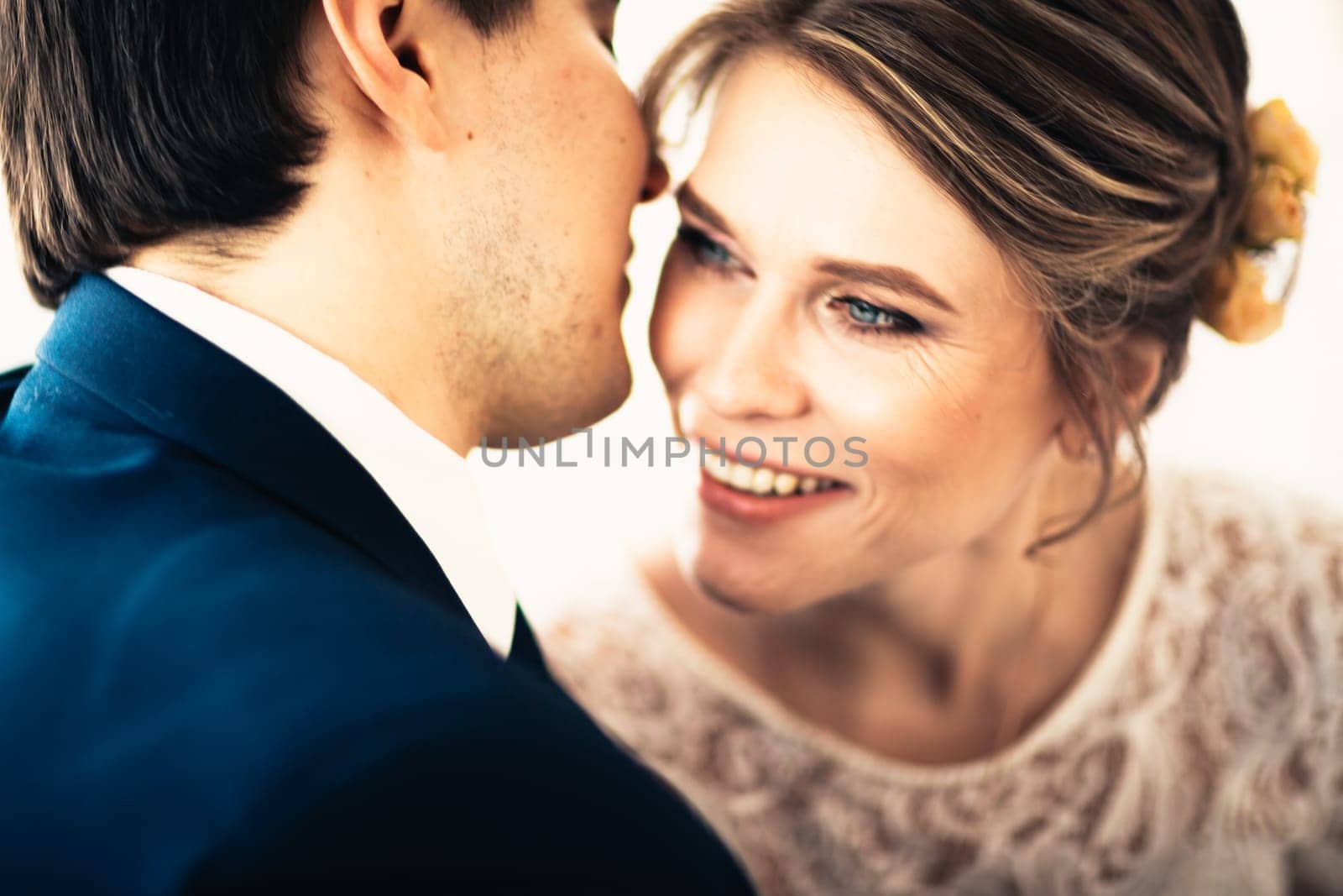 couple groom and bride near the window.