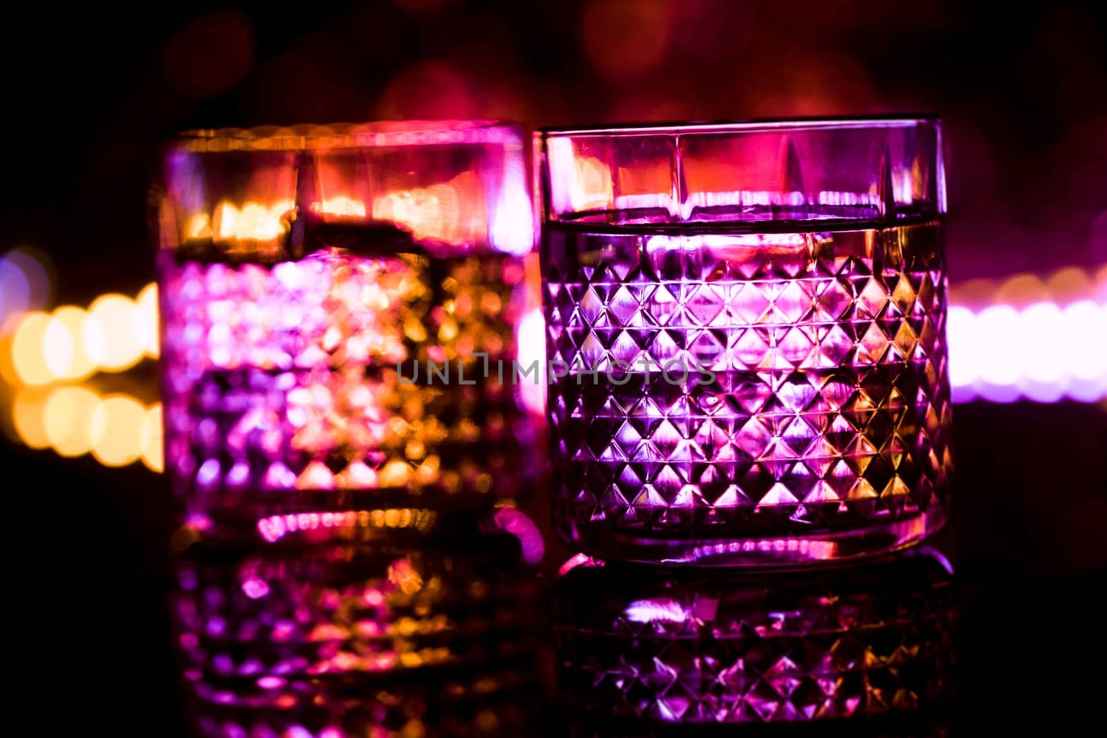 bar colored lights with glasses of alcohol.