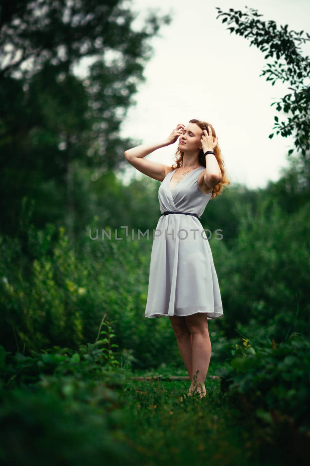 portrait of a girl against a nature background.