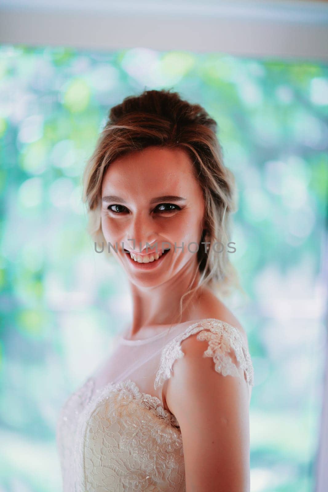 Beautiful young bride on blurred background.
