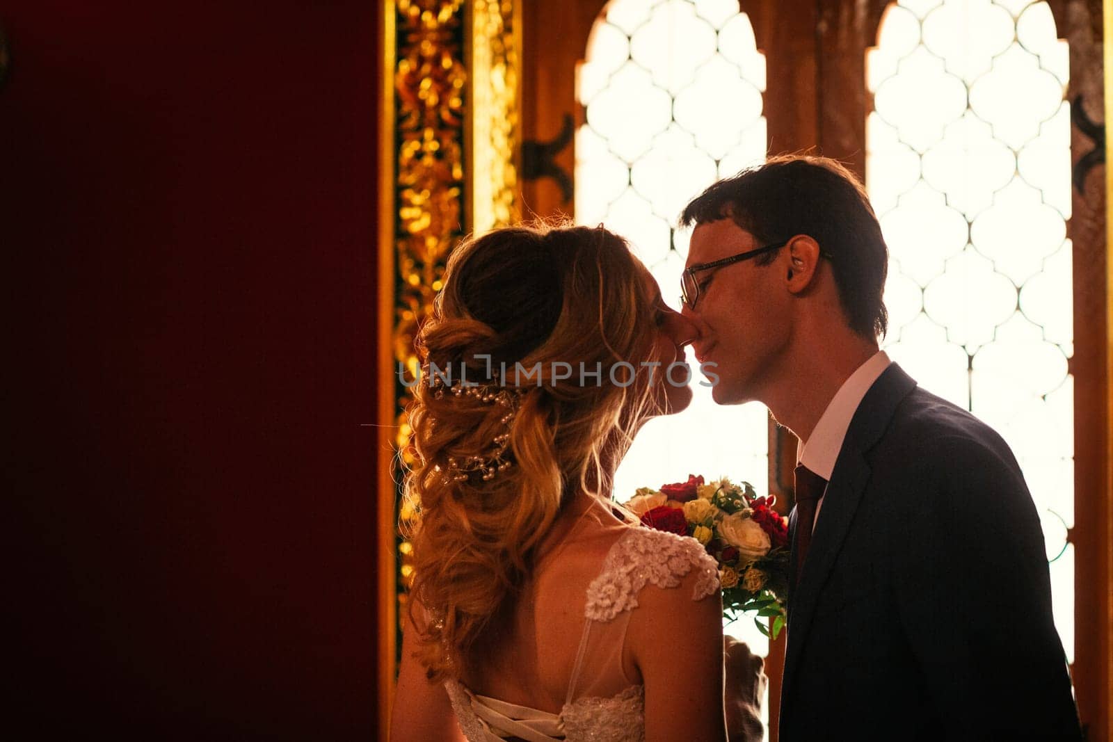 bride and groom on the background of the Kolomna Palace.