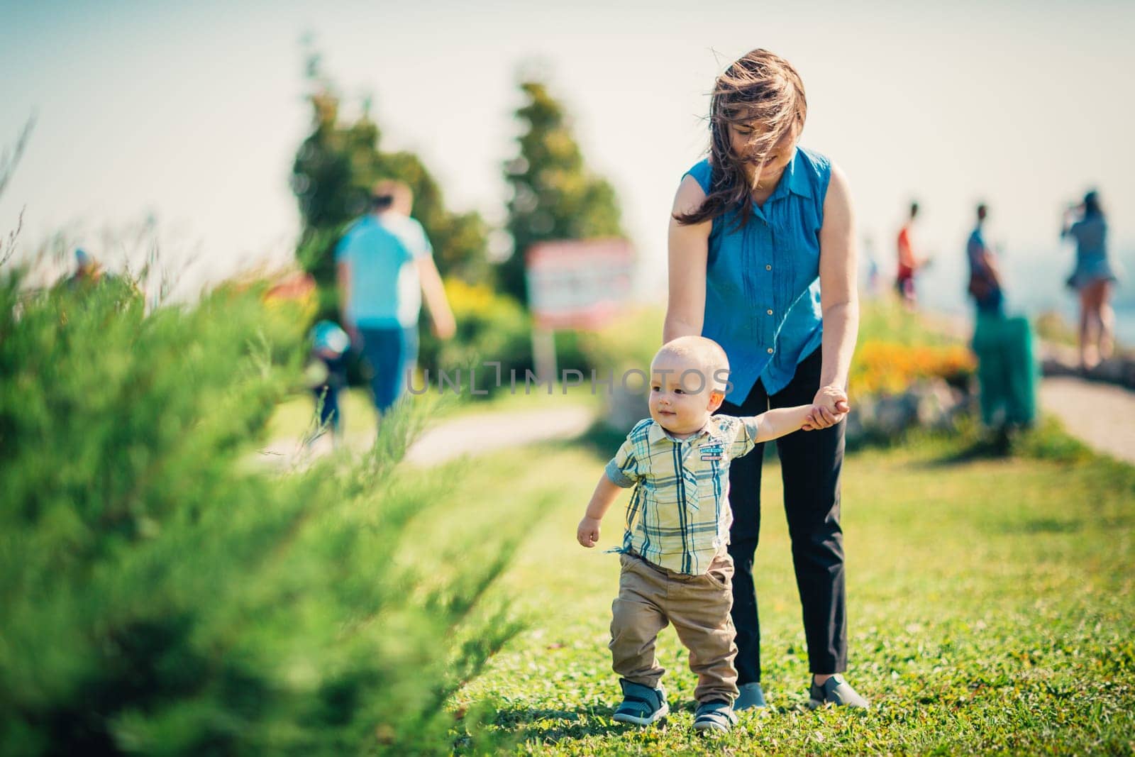 happy mother and toddler son on nature background.