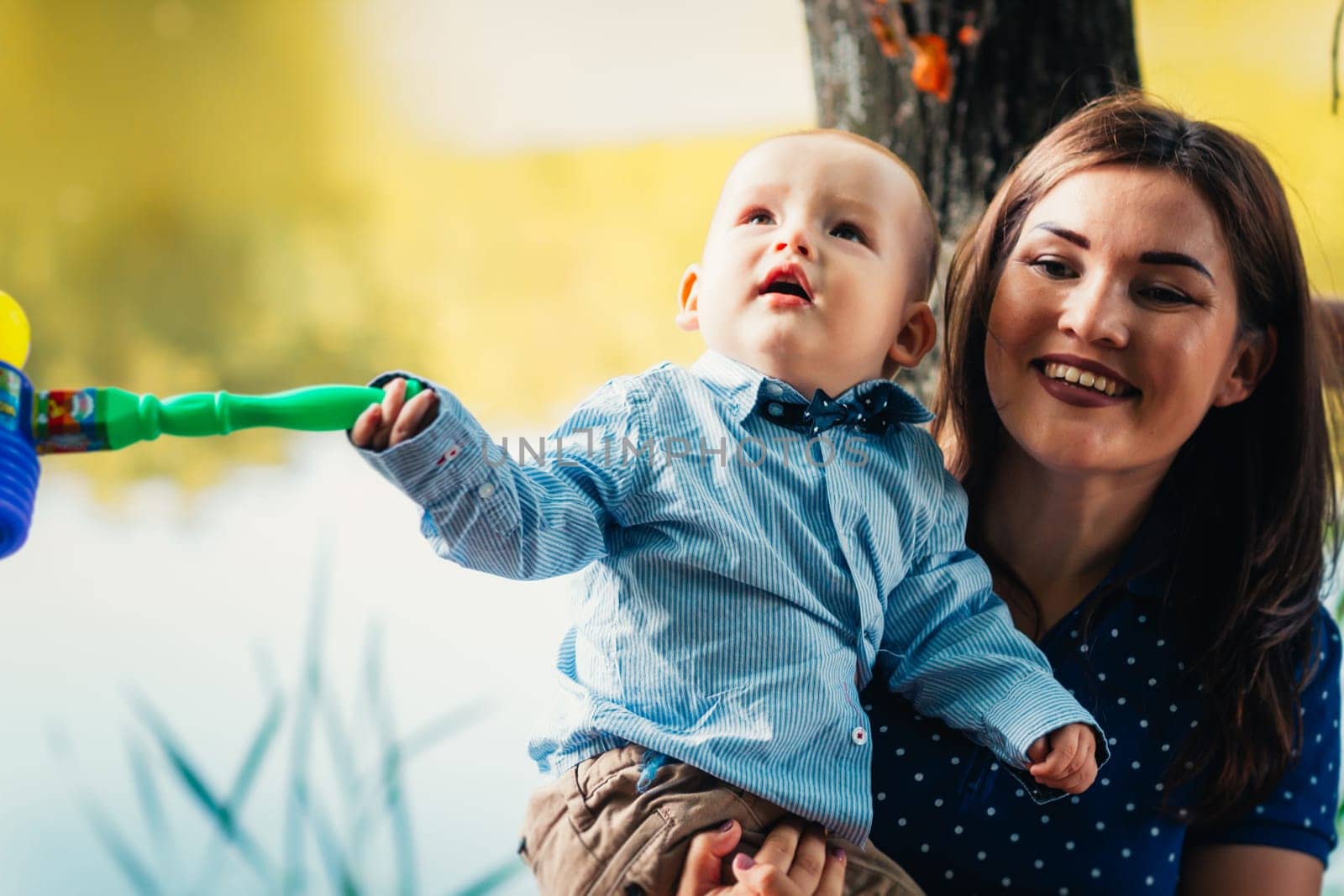 happy mother and toddler son on nature background.