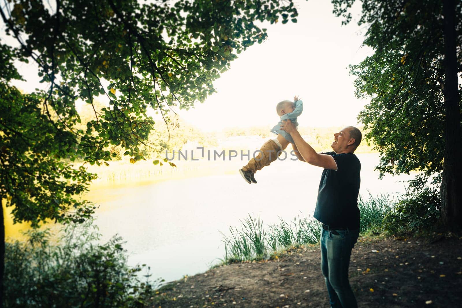 happy dad and baby on nature background.