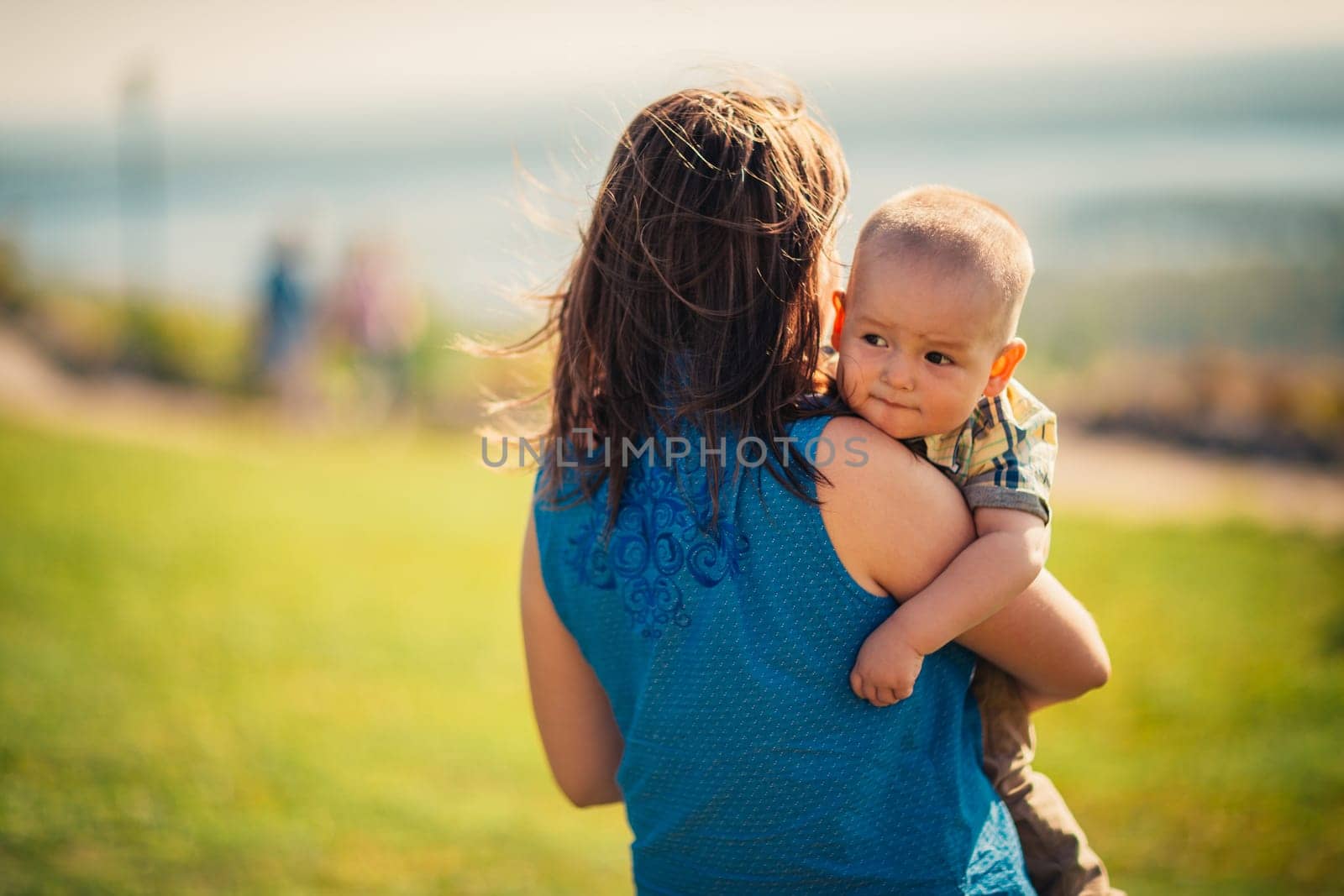 happy mother and toddler son on nature background.
