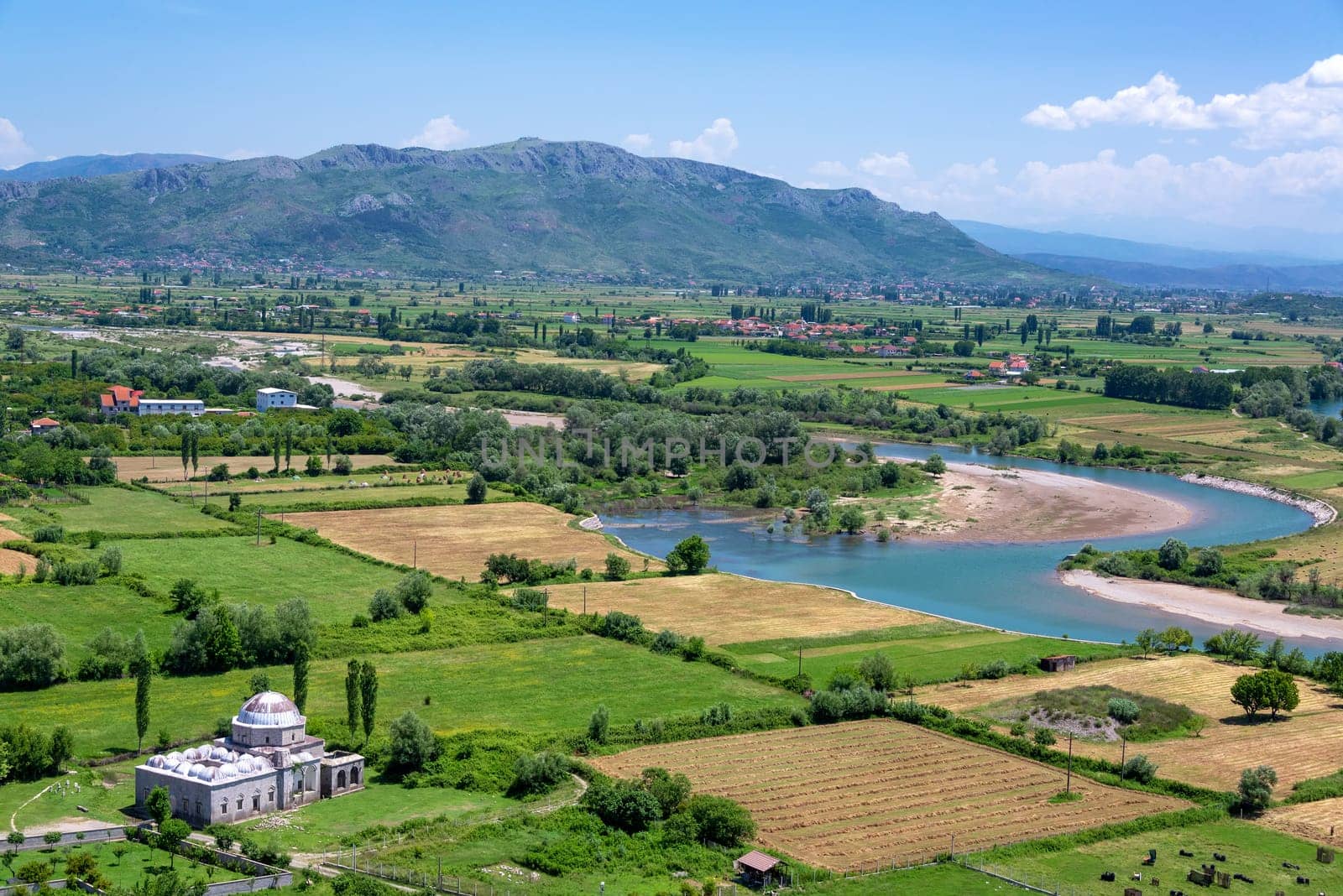 Lead mosque with lush green fields in Shkoder, Albania