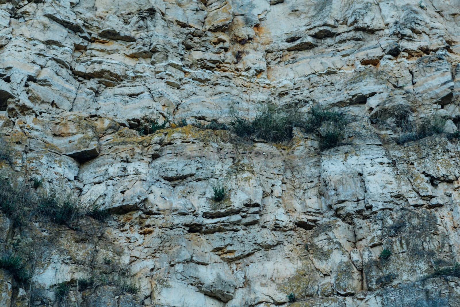 dark detailed grey stone background close up.