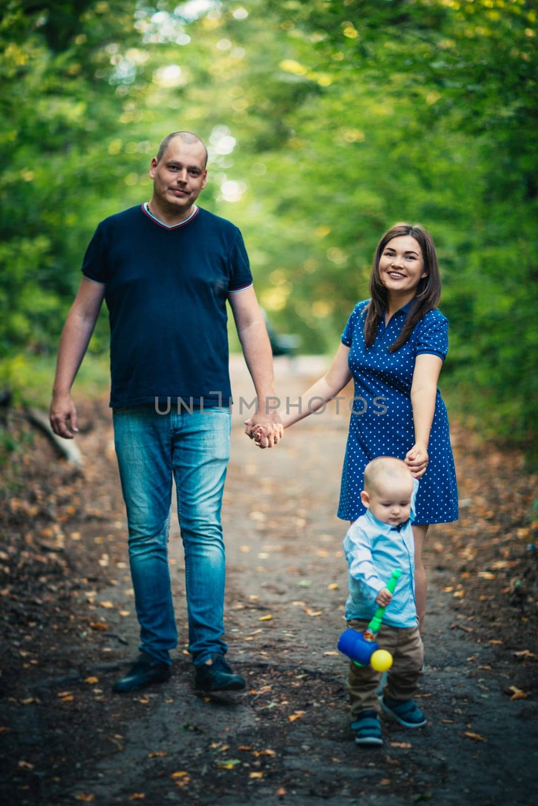 happy family with son on background forest
