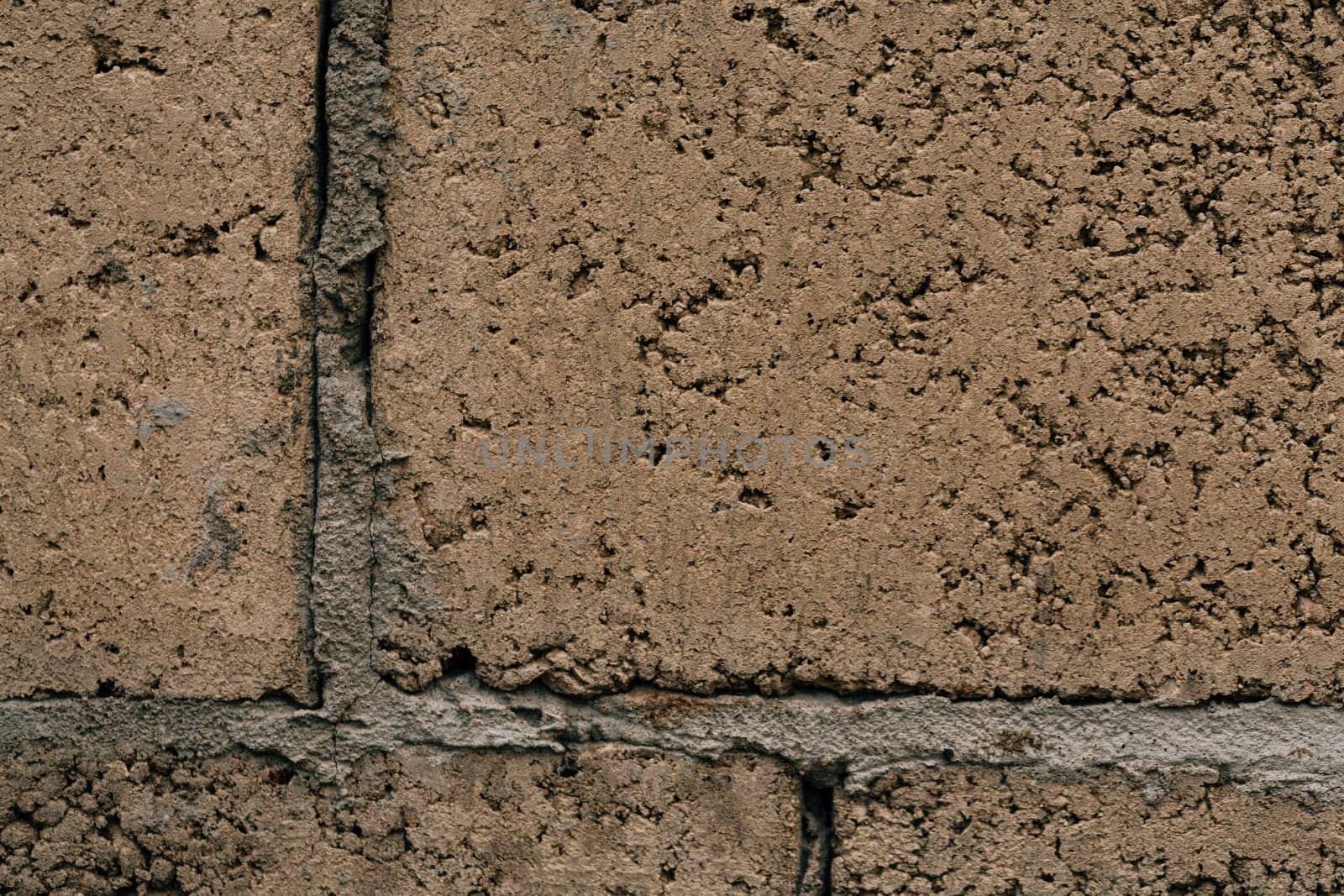 dark orange beige brick with cement close-up.