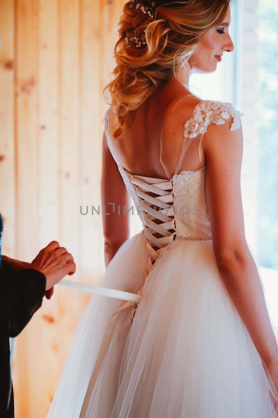 Beautiful young bride on blurred background.
