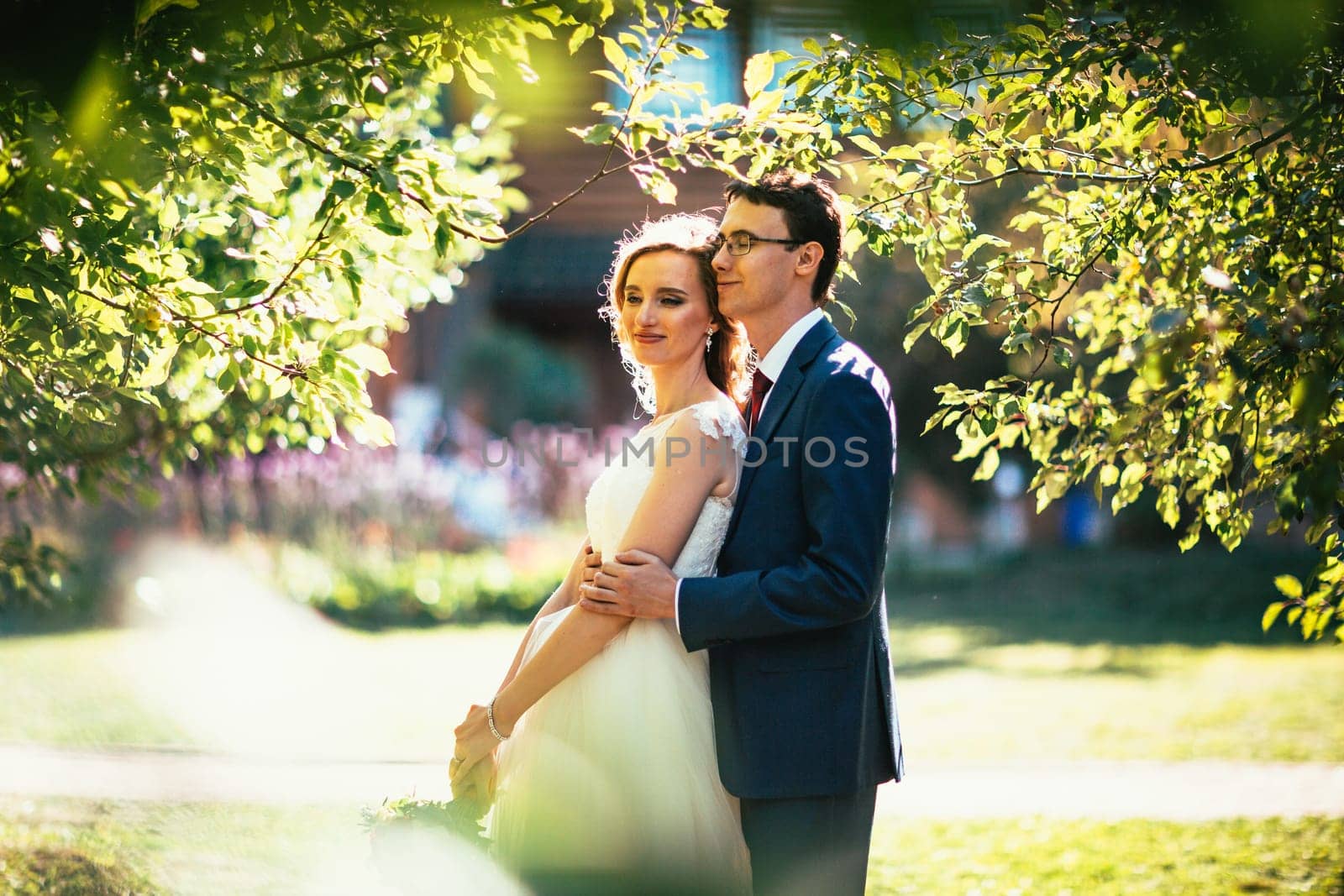 bride and groom on background summer forest.