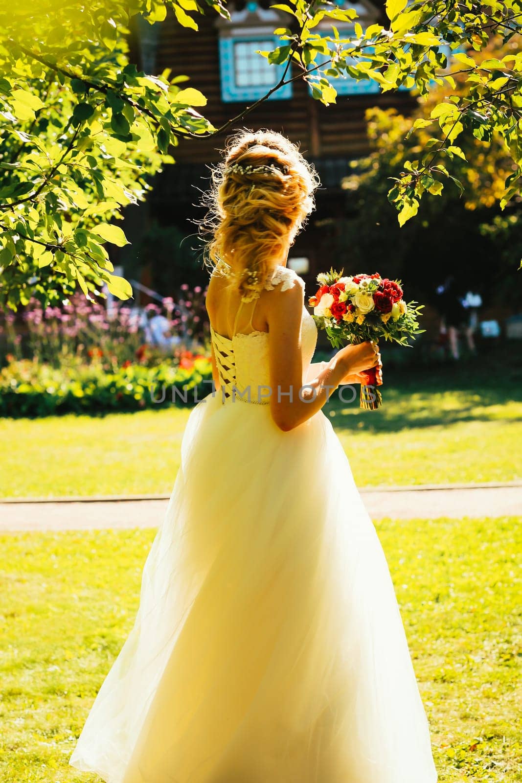 beautiful young bride in the garden background.