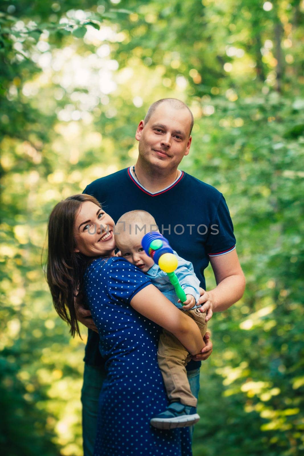 happy family with son on background forest