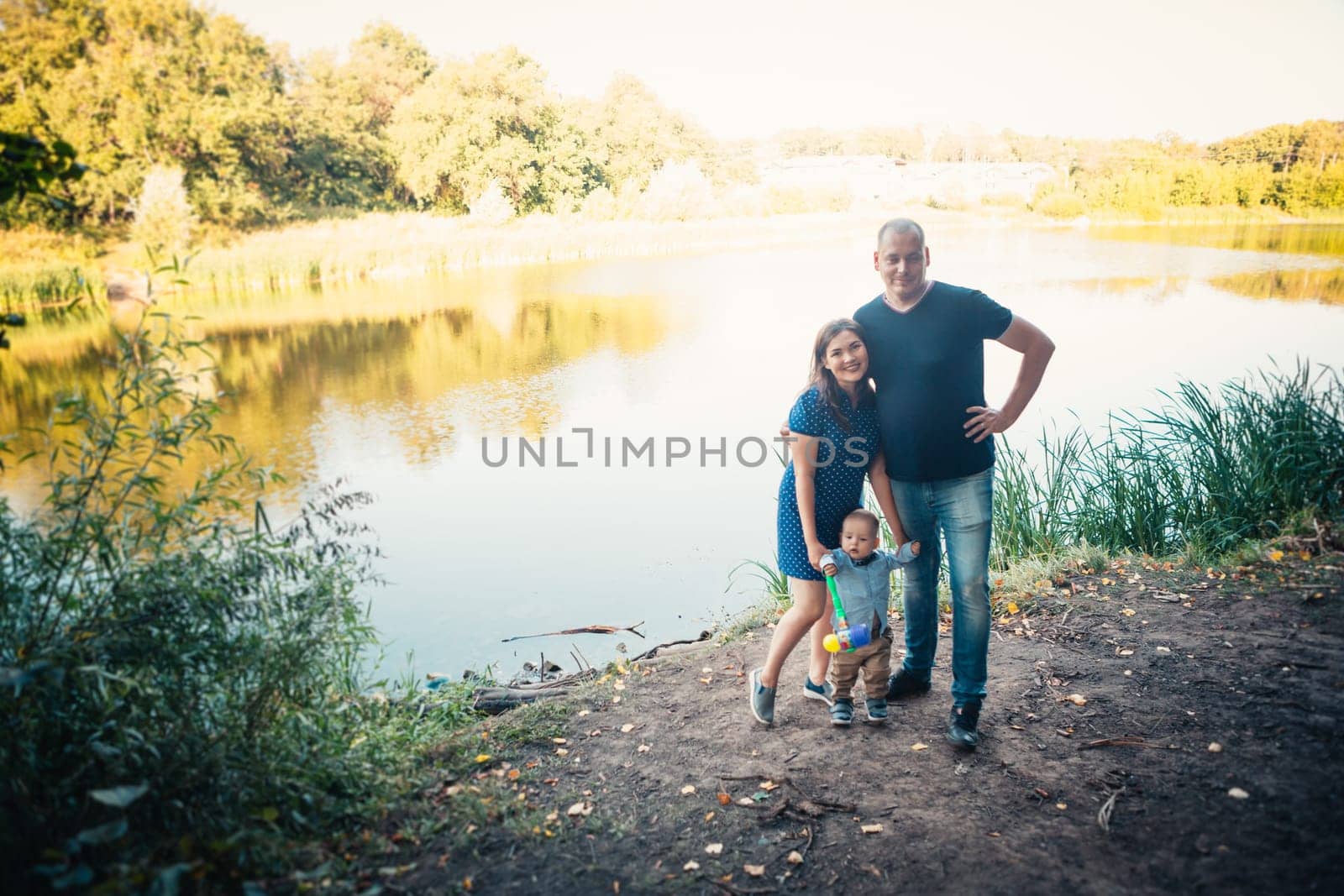 happy family with son on background forest