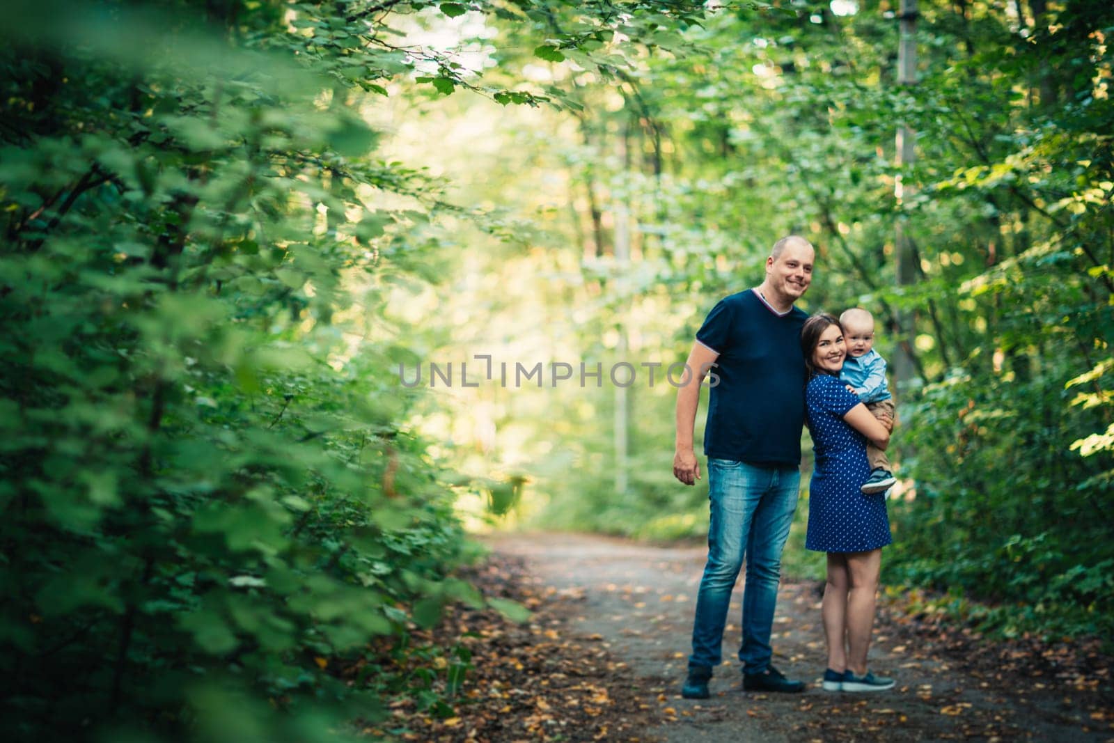 happy family with son on background forest