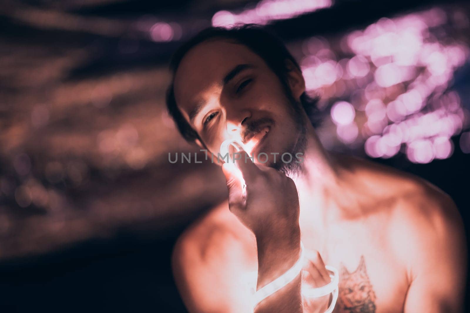Portrait man Strip Light LED tape on dark color background.