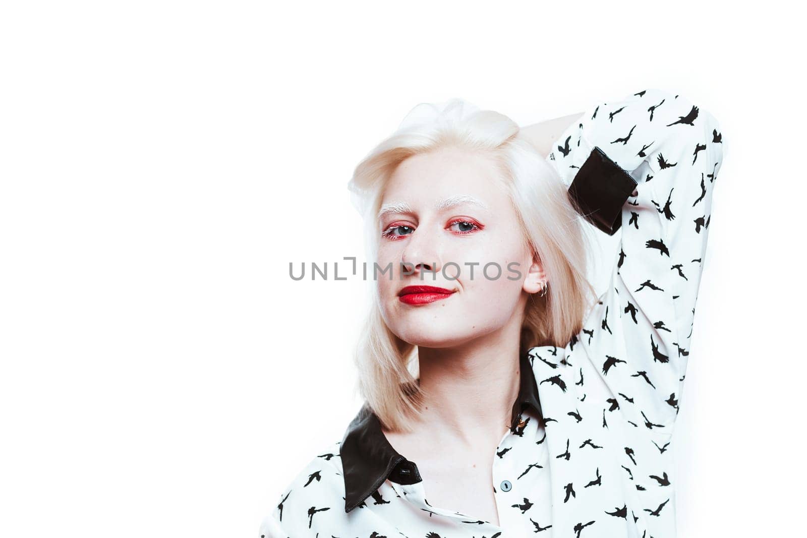 portrait blonde albino girl in studio on white background.