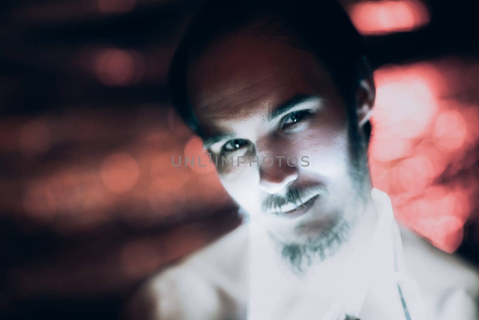 Portrait man Strip Light LED tape on dark color background.