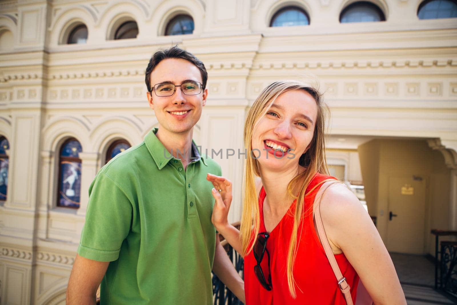girl and guy stand on the background of the bridge
