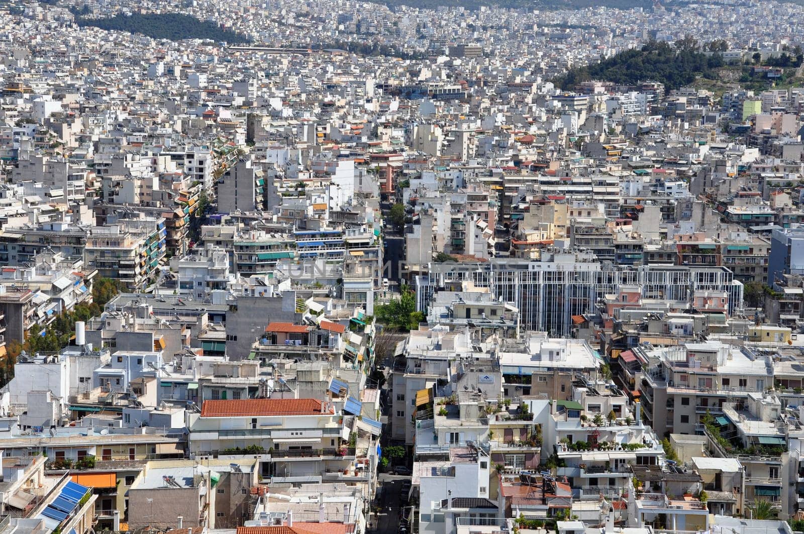 ATHENS, GREECE - APRIL 20, 2014: Apartment buildings aerial view densely populated eastern suburbs of the city of Athens, Greece.