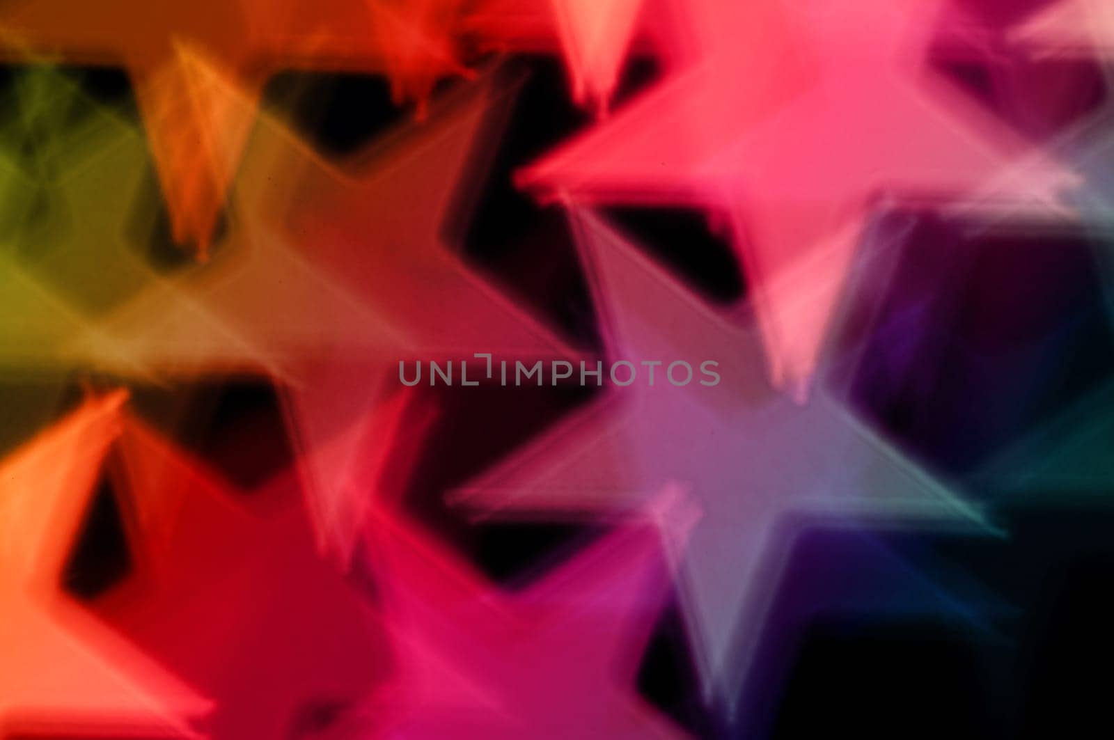 Colorful stars abstract shiny shapes blur. Holiday background.