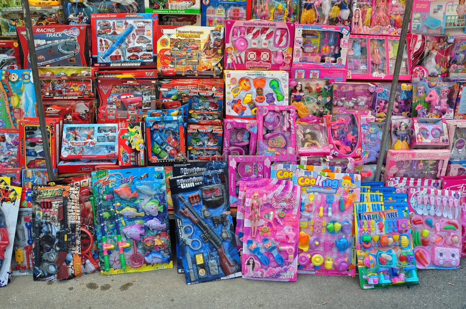 ATHENS, GREECE - AUGUST 15, 2014: Toys for girls and boys for sale at street market.