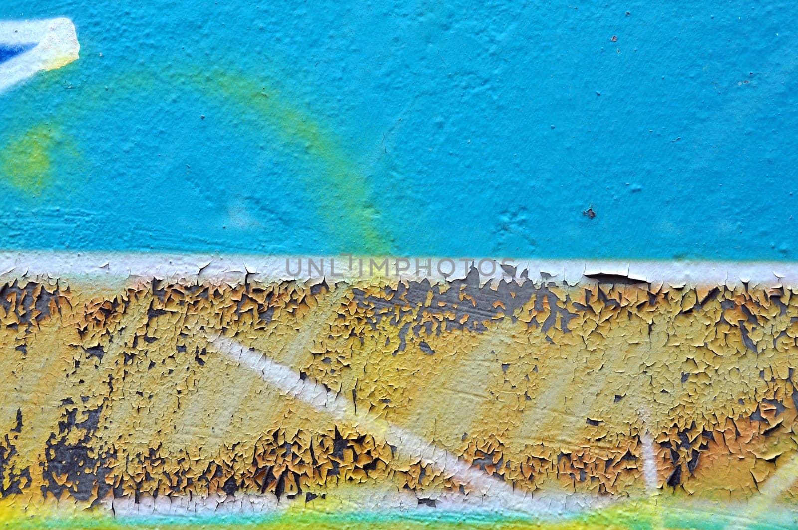 Weathered graffiti texture peeling paint and abstract smudged lines background.