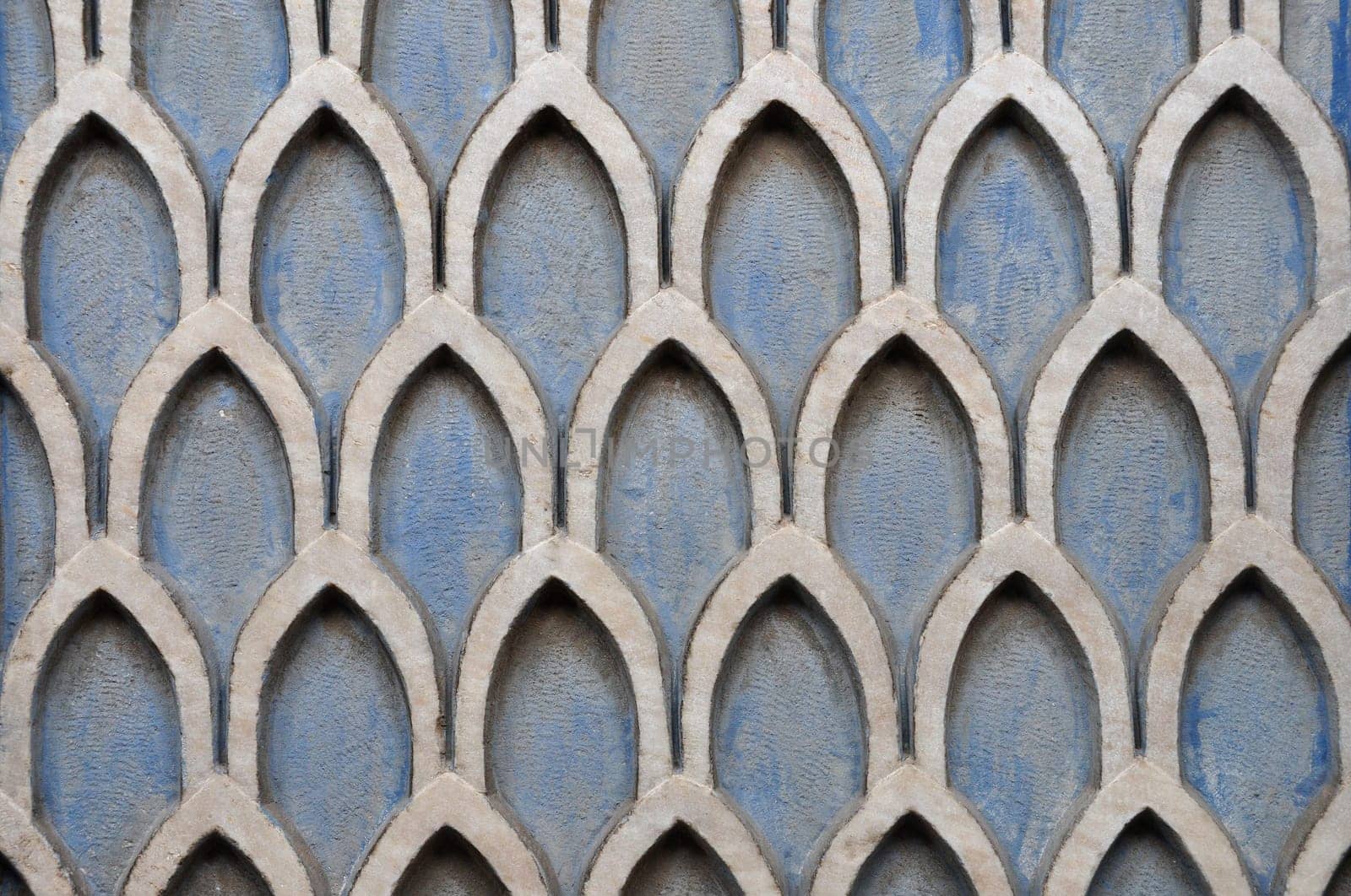 Old textured wall with geometric pattern abstract background.