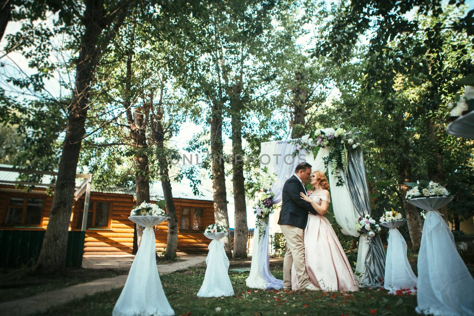 bride and groom on wedding ceremony on background nature.